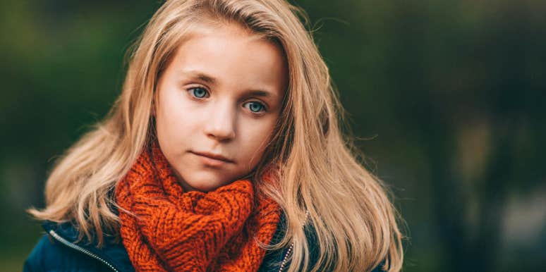 little blond girl in a red scarf