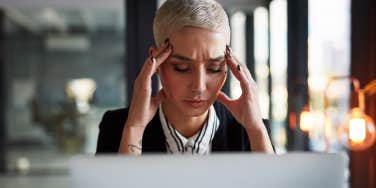 woman stressed and struggling to focus at work